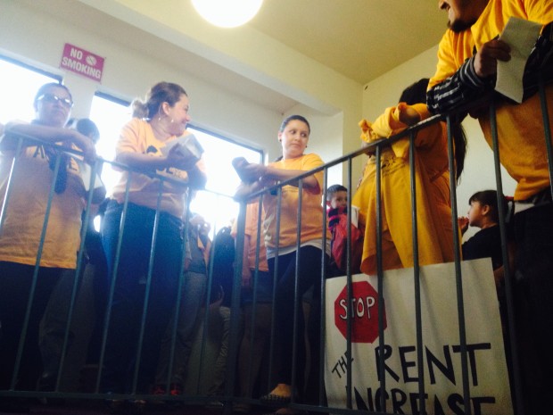Tenants of housing units on 1200 and 1300 Bissell Ave. in Richmond protest against a rent increase by their lanlord on 1st of April 2015. (Photo by Larry Zhou)